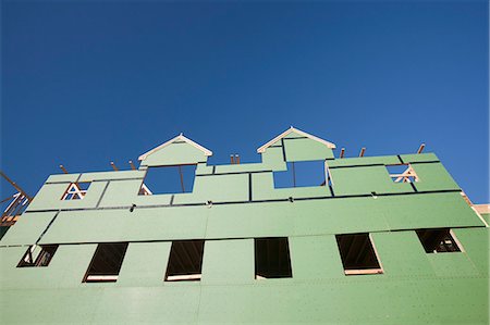 sheath - Low angle view of framed house covering with house wrap Stock Photo - Premium Royalty-Free, Code: 6105-05396050