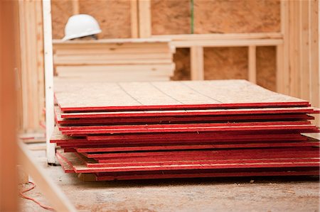 sheath - Stack of sheathing at a house under construction Stock Photo - Premium Royalty-Free, Code: 6105-05396196