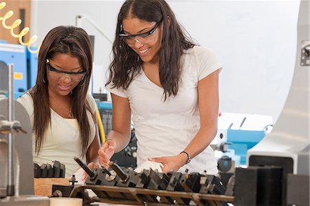 Engineering students working with tools in a laboratory Stock Photo - Premium Royalty-Free, Code: 6105-05396351