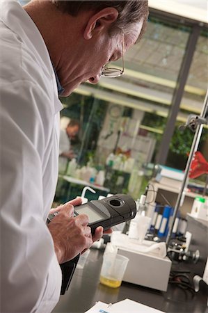 Scientist using a meter in the laboratory of water treatment plant Stock Photo - Premium Royalty-Free, Code: 6105-05396472