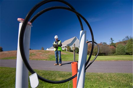 simsearch:6105-05953745,k - Cable installer working on wiring outside a house Stock Photo - Premium Royalty-Free, Code: 6105-05396590