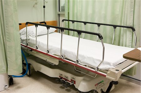 Empty hospital bed Stock Photo - Premium Royalty-Free, Code: 6105-05396712