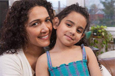 simsearch:695-03374346,k - Hispanic woman smiling with her daughter Stock Photo - Premium Royalty-Free, Code: 6105-05397209