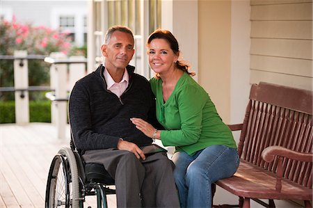 disable - Portrait of a happy couple with him in a wheelchair Stock Photo - Premium Royalty-Free, Code: 6105-06042945