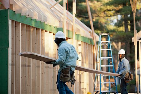 simsearch:6105-06043034,k - Carpenters moving a rafter Stock Photo - Premium Royalty-Free, Code: 6105-06042989