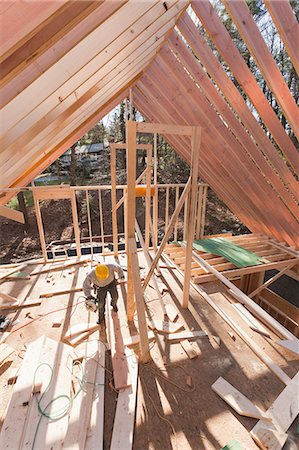 simsearch:6105-06043034,k - Carpenter working under rafters Stock Photo - Premium Royalty-Free, Code: 6105-06043055