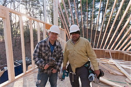 simsearch:6105-06043034,k - Portrait of carpenters with framing tools Stock Photo - Premium Royalty-Free, Code: 6105-06043058
