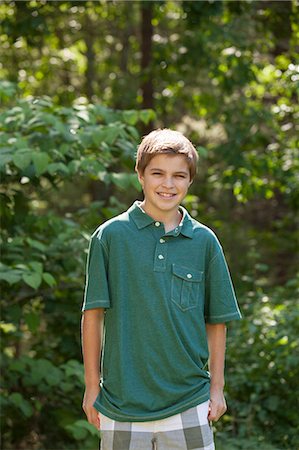polo shirt - Portrait of a boy smiling Stock Photo - Premium Royalty-Free, Code: 6105-06703012