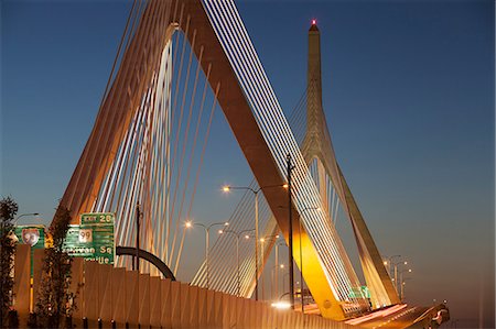 Suspension bridge lit up at dusk, Leonard P. Zakim Bunker Hill Bridge, Boston, Massachusetts, USA Stock Photo - Premium Royalty-Free, Code: 6105-06703174