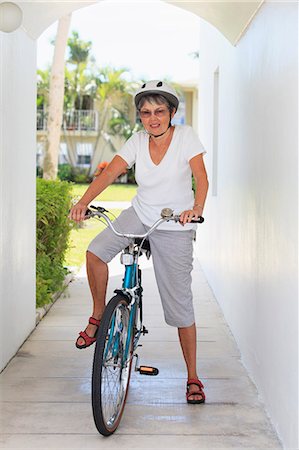 Senior woman on a bicycle Stock Photo - Premium Royalty-Free, Code: 6105-07521360
