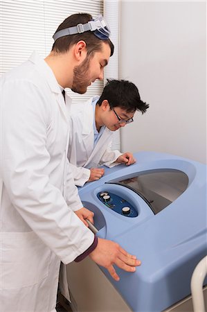 Engineering students working with a bacterial shaker and culturing machine in a laboratory Stock Photo - Premium Royalty-Free, Code: 6105-07521381