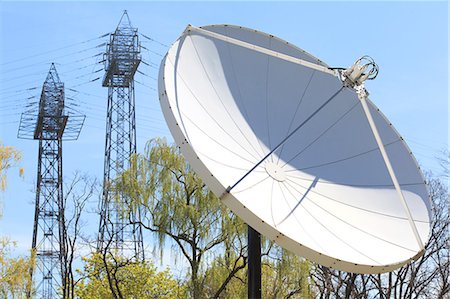 Satellite dish and power transmission towers Stock Photo - Premium Royalty-Free, Code: 6105-07521389