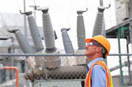 power plants - Electrical engineer examining transformers inside of an electric power plant Stock Photo - Premium Royalty-Free, Code: 6105-07521452