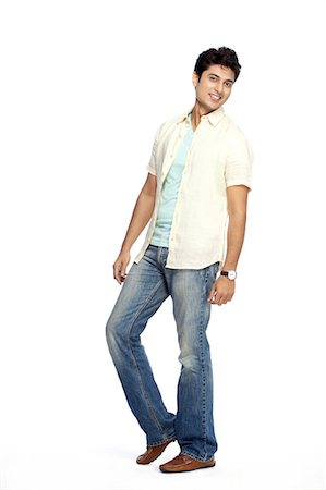 Portrait of young smiling man posing Stock Photo - Premium Royalty-Free, Code: 6107-06117641