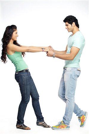 dancing on white background - Portrait of young couple dancing Stock Photo - Premium Royalty-Free, Code: 6107-06117797