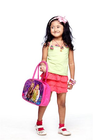 purse lips - Portrait of cute little girl with hand bag Stock Photo - Premium Royalty-Free, Code: 6107-06117715