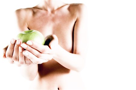 simsearch:6108-05855882,k - Naked woman holding a green apple, close up (studio) Stock Photo - Premium Royalty-Free, Code: 6108-05855901