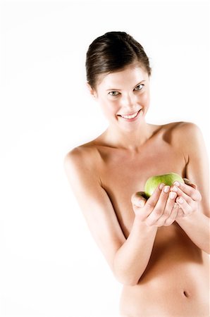 simsearch:6108-05855882,k - Naked woman holding a green apple, (studio) Stock Photo - Premium Royalty-Free, Code: 6108-05855912