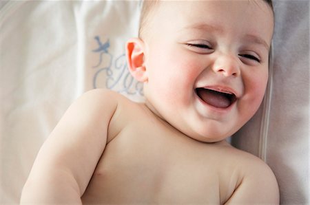 emotional happy - Portrait of a baby laughing Stock Photo - Premium Royalty-Free, Code: 6108-05856018