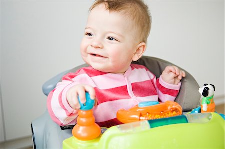 Baby in baby-walker Stock Photo - Premium Royalty-Free, Code: 6108-05856020