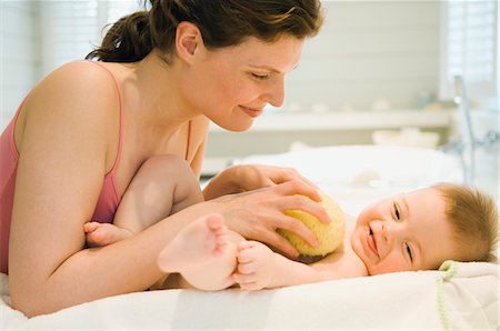 Mother washing her baby Stock Photo - Premium Royalty-Free, Code: 6108-05856039
