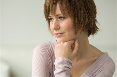 Portrait of a young thinking woman Stock Photo - Premium Royalty-Free, Code: 6108-05856458