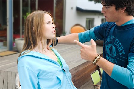 siblings fighting - Teenage boy scolding teenage girl Stock Photo - Premium Royalty-Free, Code: 6108-05857790