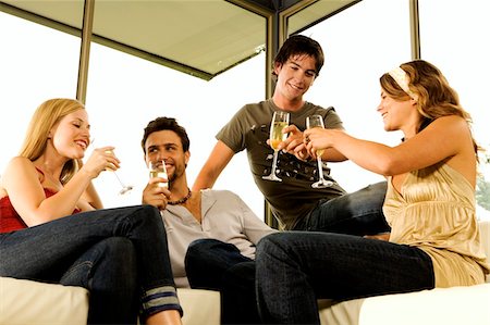 simsearch:6108-05857751,k - 2 young couples drinking champagne Stock Photo - Premium Royalty-Free, Code: 6108-05857852