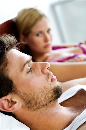 Young couple in bed Stock Photo - Premium Royalty-Free, Code: 6108-05857886