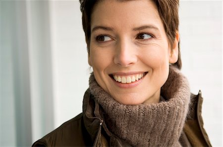 simsearch:6108-05859747,k - Close-up of a mid adult woman smiling Stock Photo - Premium Royalty-Free, Code: 6108-05859790