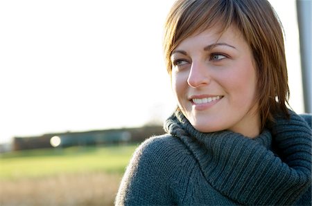 simsearch:6108-05859747,k - Close-up of a young woman smiling Stock Photo - Premium Royalty-Free, Code: 6108-05859845