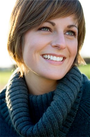 simsearch:6108-05859747,k - Close-up of a young woman smiling Stock Photo - Premium Royalty-Free, Code: 6108-05859808