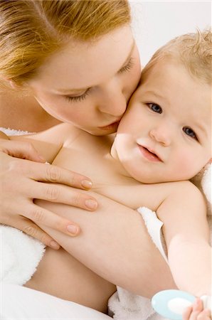 simsearch:6108-05860153,k - Close-up of a young woman kissing her son Stock Photo - Premium Royalty-Free, Code: 6108-05860159