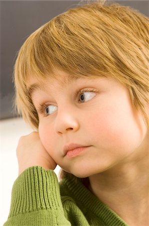 simsearch:6108-05863386,k - Close-up of a boy thinking Stock Photo - Premium Royalty-Free, Code: 6108-05860241