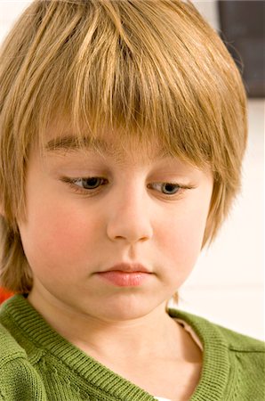 simsearch:6108-05863386,k - Close-up of a boy looking serious Stock Photo - Premium Royalty-Free, Code: 6108-05860259