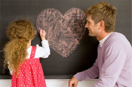 simsearch:6108-05860263,k - Girl drawing on a blackboard with her father watching her Stock Photo - Premium Royalty-Free, Code: 6108-05860231