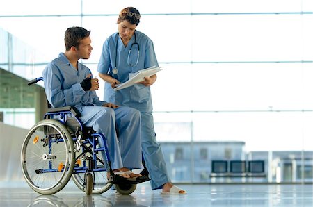 doctor patient looking - Female doctor showing a medical record to a patient Stock Photo - Premium Royalty-Free, Code: 6108-05860435