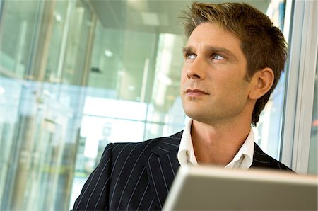 simsearch:6108-05860554,k - Close-up of a businessman looking away Stock Photo - Premium Royalty-Free, Code: 6108-05860505