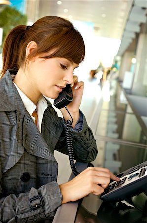 simsearch:6108-05860554,k - Businesswoman talking on the telephone at an airport Stock Photo - Premium Royalty-Free, Code: 6108-05860530