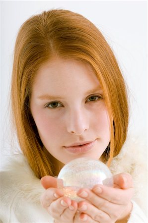 Portrait of a young woman holding a crystal ball Stock Photo - Premium Royalty-Free, Code: 6108-05860651