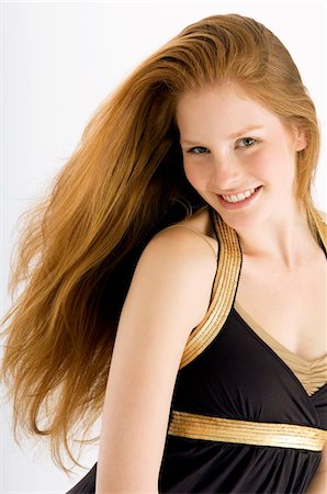 Portrait of a young woman smiling Stock Photo - Premium Royalty-Free, Code: 6108-05861007