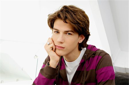 Portrait of a teenage boy looking serious Stock Photo - Premium Royalty-Free, Code: 6108-05861198