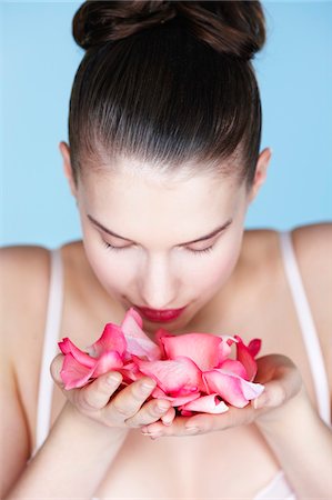 rose scent - Young woman smelling rose petals Stock Photo - Premium Royalty-Free, Code: 6108-05861318