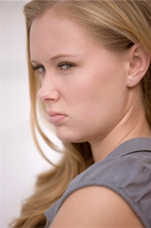 simsearch:6108-05863386,k - Portrait of a woman looking annoyed Stock Photo - Premium Royalty-Free, Code: 6108-05861795