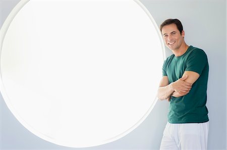 Portrait of a man smiling Stock Photo - Premium Royalty-Free, Code: 6108-05861862