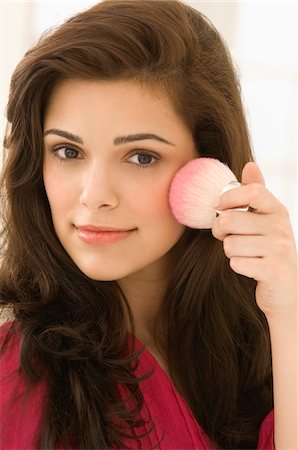 simsearch:6108-05873814,k - Woman applying blusher on her face Stock Photo - Premium Royalty-Free, Code: 6108-05862290