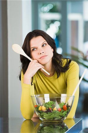 simsearch:6108-05863386,k - Woman thinking in the kitchen Stock Photo - Premium Royalty-Free, Code: 6108-05862539