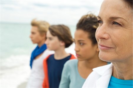 emotional woman looking away - Family on the beach Stock Photo - Premium Royalty-Free, Code: 6108-05862607