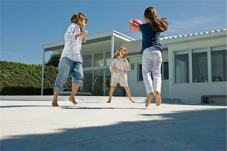 Children playing with a ball Stock Photo - Premium Royalty-Free, Code: 6108-05863016