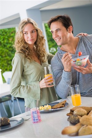 simsearch:6108-05864945,k - Couple at the breakfast table Stock Photo - Premium Royalty-Free, Code: 6108-05863251